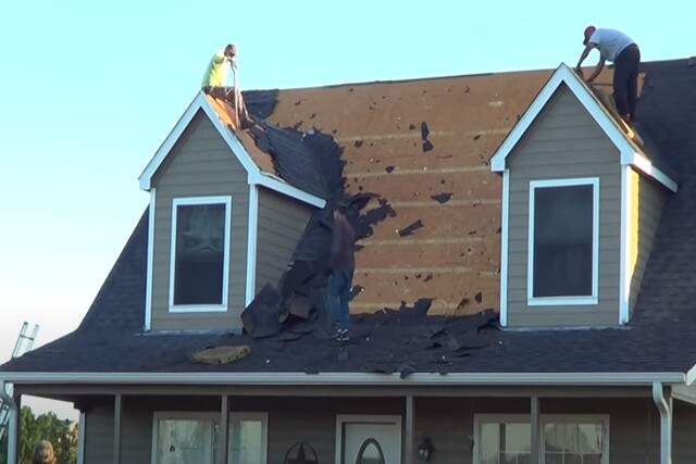 Full roof replacement by two workers