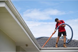 Gutter cleaner cleaning house gutters