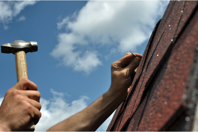 Roof repairs done by worker